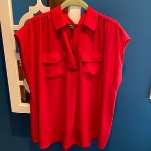 Woman’s red sleeveless blouse